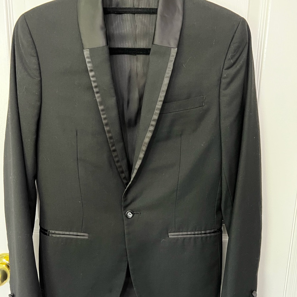 Le Chateau black men’s tuxedo style suit.